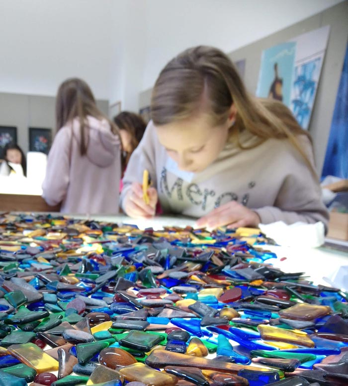 Young student working with glass