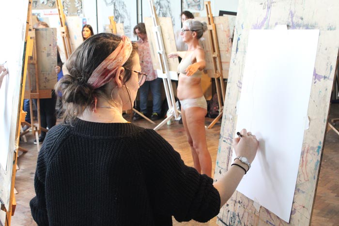 Student drawing life model