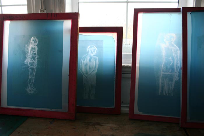 Silk screens being washed.